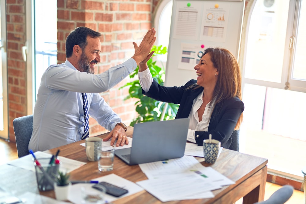 A small business owner reviewing payment statements with a consultant